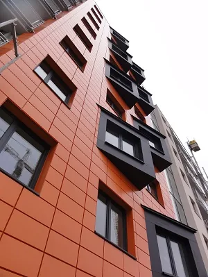 The sheet-metal façade of an apartment building